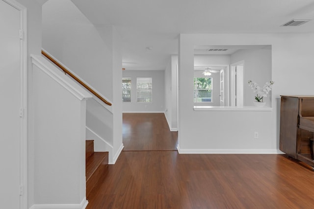 7918 Swan Ln, Baytown, TX 77523 - entrance foyer with wood finished floors, stairs, baseboards, and ceiling fan
