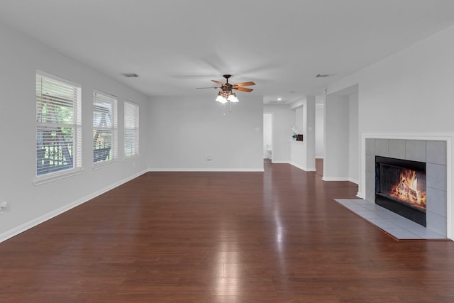 7918 Swan Ln, Baytown, TX 77523 - unfurnished living room with a fireplace, wood finished floors, ceiling fan, and baseboards