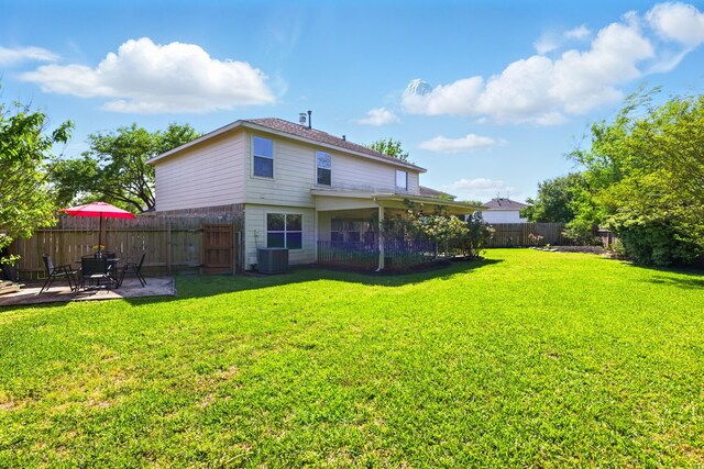 7918 Swan Ln, Baytown, TX 77523 - rear view of property with a patio and central AC unit