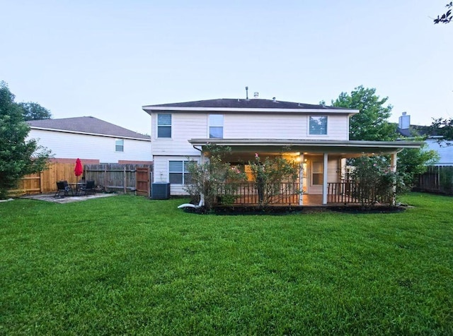 7918 Swan Ln, Baytown, TX 77523 - rear view of house featuring central AC and a patio area