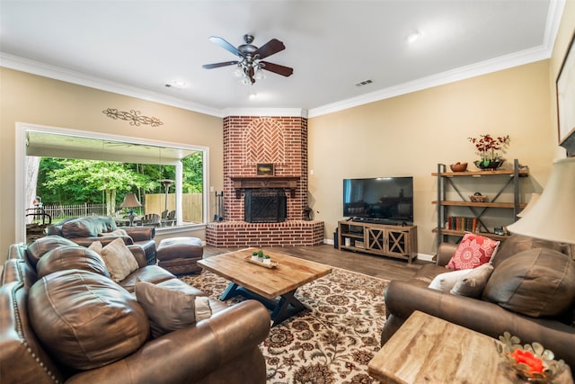 143 Park Way, Montgomery, TX 77356 - living room with a ceiling fan, crown molding, wood finished floors, a fireplace, and baseboards