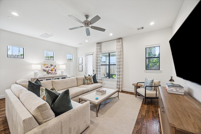 living room with dark wood-style flooring, recessed lighting, ceiling fan, and baseboards