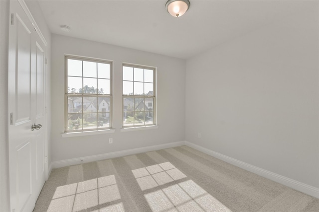 13140 Soaring Forest Dr, Conroe, TX 77302 - empty room featuring light colored carpet and baseboards