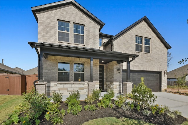 13140 Soaring Forest Dr, Conroe, TX 77302 - view of front of house featuring covered porch, a garage, driveway, and brick siding