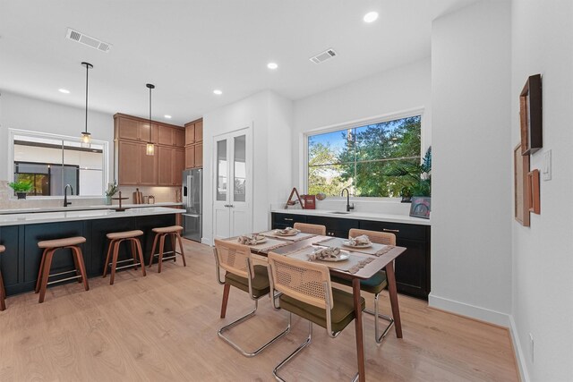1503 Vermont St Unit D, Houston, TX 77006 - dining space featuring light wood-style flooring, recessed lighting, and baseboards