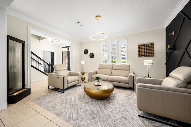 16019 Mickleham Dr, Spring, TX 77379 - living area with crown molding, stairway, light tile patterned floors, and a textured ceiling