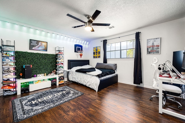 16019 Mickleham Dr, Spring, TX 77379 - bedroom featuring wood finished floors, a textured ceiling, an office area, and a ceiling fan