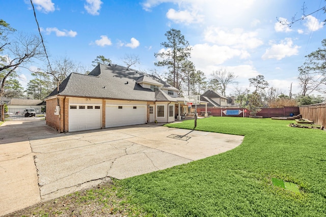 16019 Mickleham Dr, Spring, TX 77379 - rear view of house featuring a shingled roof, brick siding, and concrete driveway