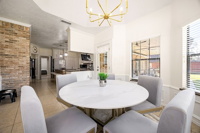 16019 Mickleham Dr, Spring, TX 77379 - dining room featuring a chandelier and light tile patterned flooring