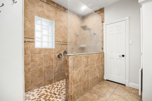 16019 Mickleham Dr, Spring, TX 77379 - full bathroom featuring tiled shower and tile patterned floors
