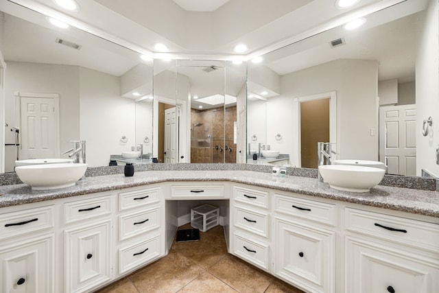 16019 Mickleham Dr, Spring, TX 77379 - full bathroom with a stall shower, double vanity, tile patterned floors, and recessed lighting