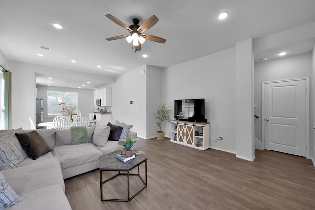 9040 Pecos Pl, Willis, TX 77378 - living room with a ceiling fan, wood finished floors, recessed lighting, and baseboards