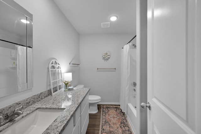 9040 Pecos Pl, Willis, TX 77378 - bathroom featuring vanity, toilet, baseboards, shower / tub combo, and wood finished floors