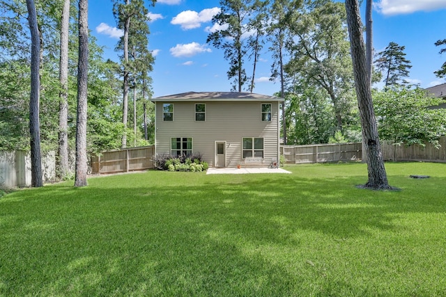 9040 Pecos Pl, Willis, TX 77378 - rear view of house with a patio area