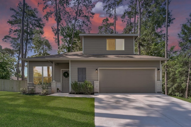 9040 Pecos Pl, Willis, TX 77378 - view of front of house with driveway, an attached garage, and stone siding