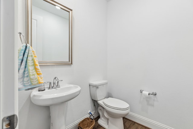 15003 Big Spring Park Dr, Cypress, TX 77433 - half bath with wood finished floors, toilet, and baseboards