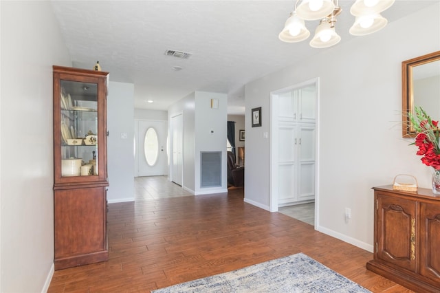 2207 Azalea Cir, Huntsville, TX 77340 - corridor with a chandelier, wood finished floors, and baseboards