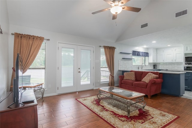 2207 Azalea Cir, Huntsville, TX 77340 - living room featuring french doors, wood finished floors, a ceiling fan, lofted ceiling, and baseboards
