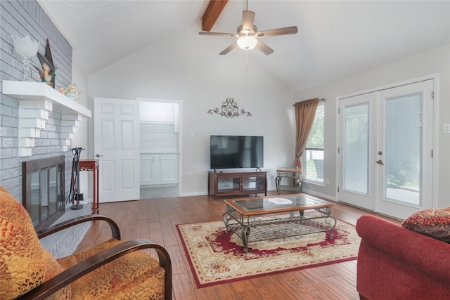 2207 Azalea Cir, Huntsville, TX 77340 - living area with french doors, hardwood / wood-style flooring, high vaulted ceiling, beamed ceiling, and a brick fireplace
