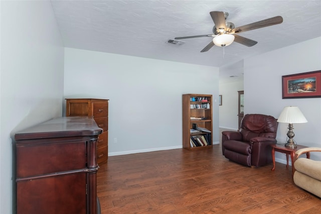 2207 Azalea Cir, Huntsville, TX 77340 - living area featuring ceiling fan, dark wood-style floors, and baseboards