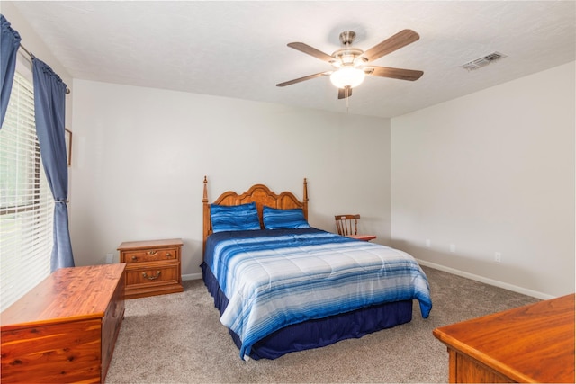 2207 Azalea Cir, Huntsville, TX 77340 - bedroom with carpet flooring, baseboards, and a ceiling fan