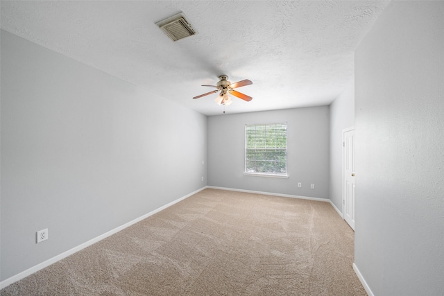 2502 Sea Horse Ct, Seabrook, TX 77586 - carpeted spare room featuring ceiling fan, baseboards, and a textured ceiling