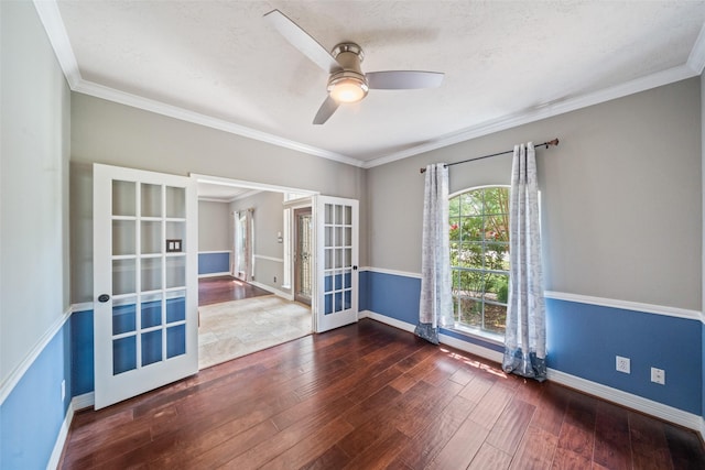 2502 Sea Horse Ct, Seabrook, TX 77586 - unfurnished room with french doors, hardwood / wood-style flooring, baseboards, a ceiling fan, and crown molding