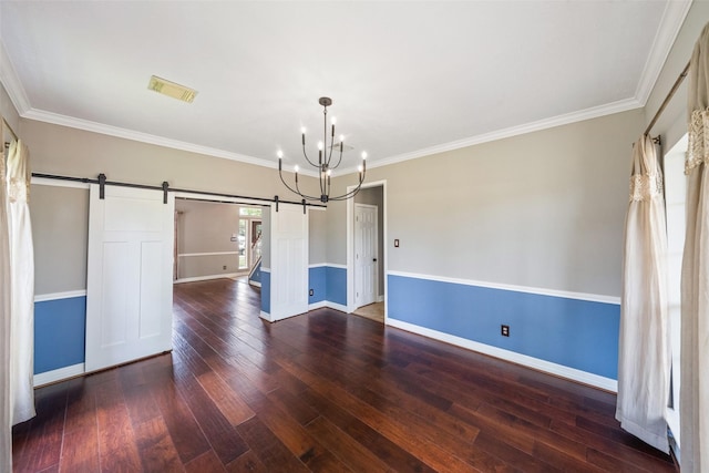 2502 Sea Horse Ct, Seabrook, TX 77586 - spare room with a barn door, a chandelier, hardwood / wood-style floors, baseboards, and ornamental molding