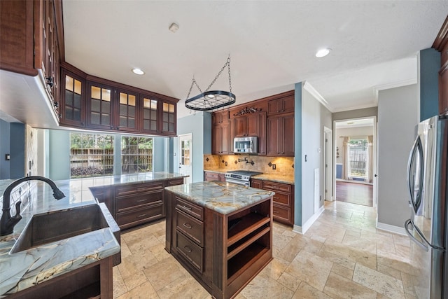 2502 Sea Horse Ct, Seabrook, TX 77586 - kitchen with stainless steel appliances, a sink, stone tile floors, tasteful backsplash, and recessed lighting
