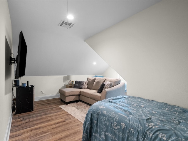 8253 Carolyn St, Santa Fe, TX 77517 - bedroom with wood finished floors, lofted ceiling, and baseboards