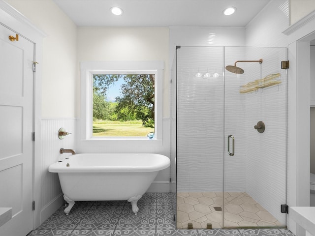 8253 Carolyn St, Santa Fe, TX 77517 - full bath with a soaking tub, wainscoting, a stall shower, tile patterned flooring, and recessed lighting