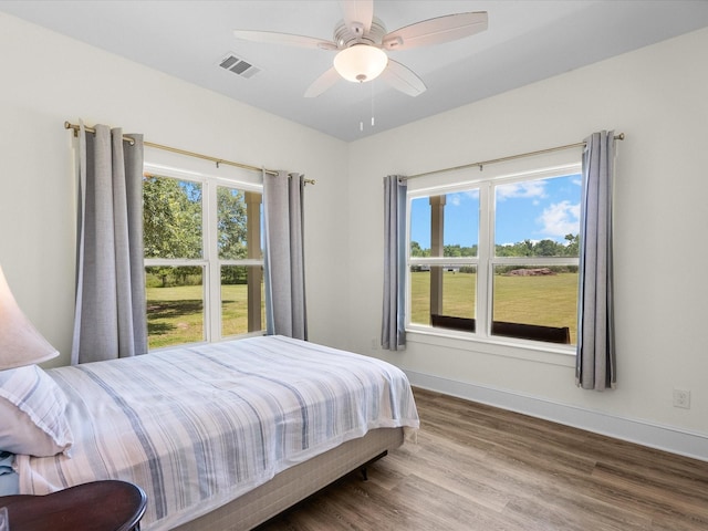 8253 Carolyn St, Santa Fe, TX 77517 - bedroom featuring wood finished floors, baseboards, and a ceiling fan