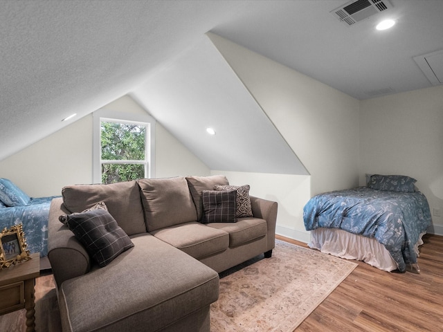 8253 Carolyn St, Santa Fe, TX 77517 - bedroom with wood finished floors, lofted ceiling, attic access, baseboards, and recessed lighting