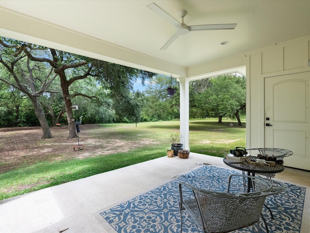 8253 Carolyn St, Santa Fe, TX 77517 - view of patio featuring a ceiling fan and view of scattered trees