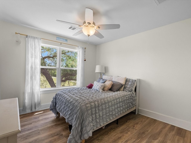 8253 Carolyn St, Santa Fe, TX 77517 - bedroom featuring wood finished floors, baseboards, and a ceiling fan