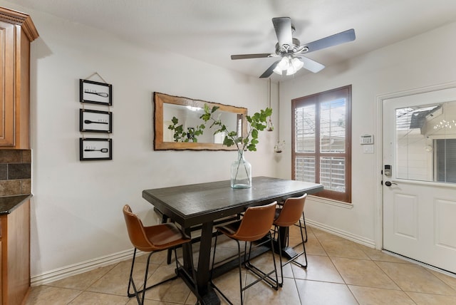 27 Medley Ln, The Woodlands, TX 77382 - dining space with ceiling fan and light tile patterned floors