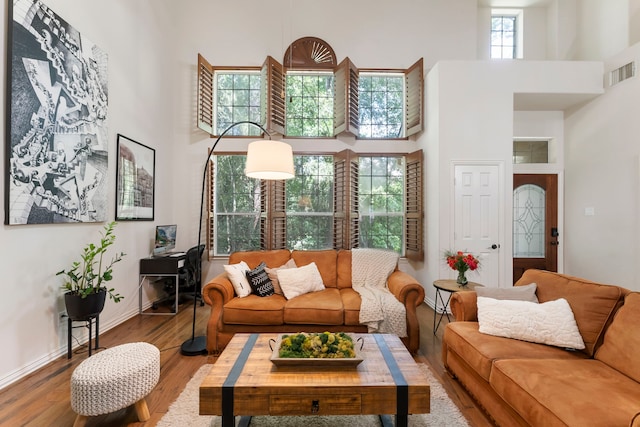 27 Medley Ln, The Woodlands, TX 77382 - living room with a high ceiling and wood finished floors