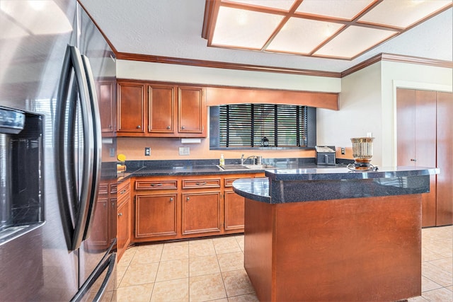 15415 Swan Creek Dr, Houston, TX 77095 - kitchen with stainless steel fridge, brown cabinets, ornamental molding, a sink, and light tile patterned floors