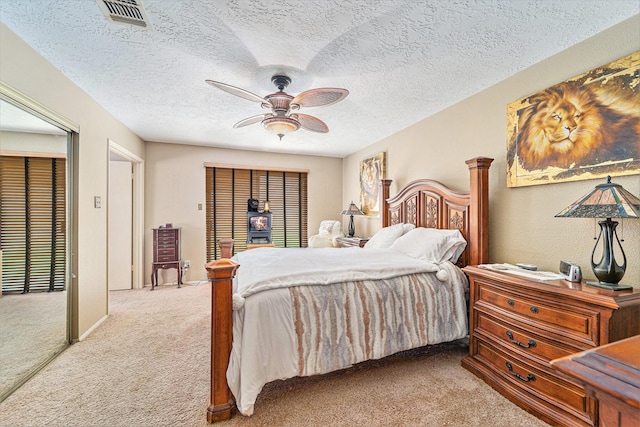 15415 Swan Creek Dr, Houston, TX 77095 - bedroom featuring light carpet, a ceiling fan, and a textured ceiling