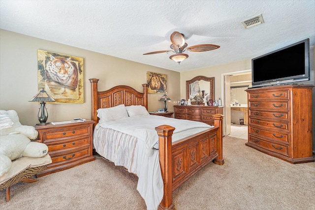 15415 Swan Creek Dr, Houston, TX 77095 - bedroom featuring light carpet, a textured ceiling, ceiling fan, and ensuite bath