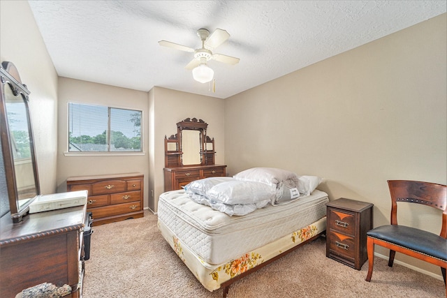 15415 Swan Creek Dr, Houston, TX 77095 - bedroom featuring light colored carpet, a textured ceiling, ceiling fan, and baseboards