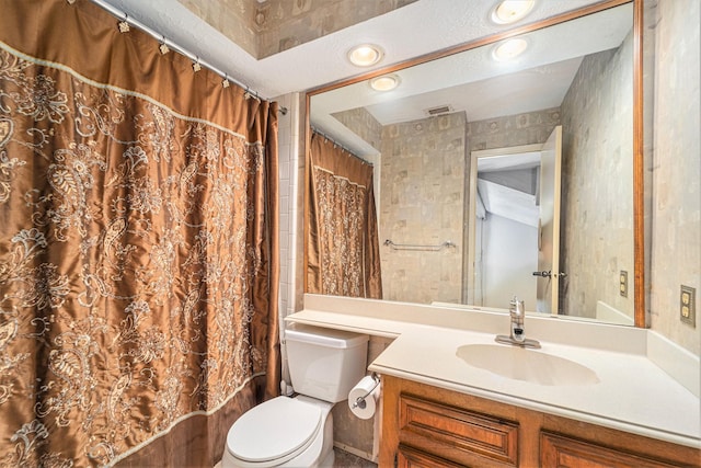 15415 Swan Creek Dr, Houston, TX 77095 - full bathroom featuring vanity, toilet, shower / bathtub combination with curtain, and recessed lighting