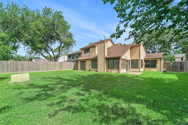15415 Swan Creek Dr, Houston, TX 77095 - back of property with a sunroom and a shingled roof