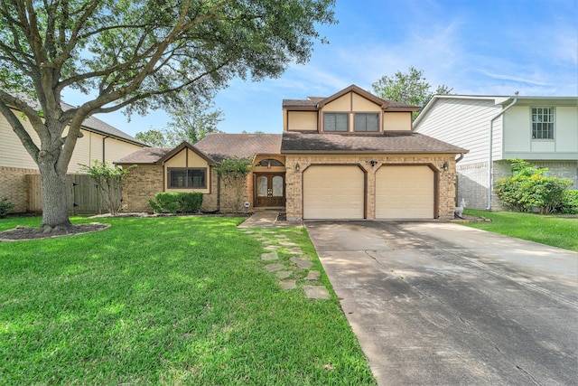 15415 Swan Creek Dr, Houston, TX 77095 - tudor-style house featuring concrete driveway, a front yard, an attached garage, and brick siding