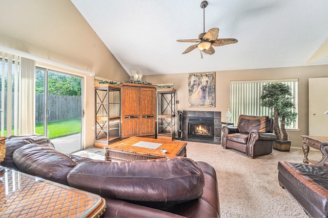 15415 Swan Creek Dr, Houston, TX 77095 - living area featuring vaulted ceiling, light carpet, a ceiling fan, and a tiled fireplace