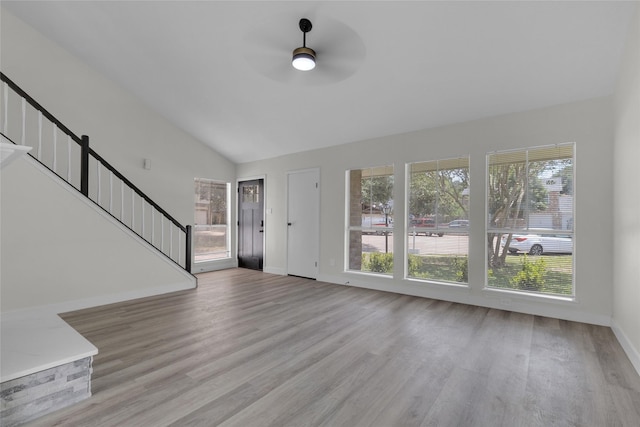 18010 Santolina Ln, Katy, TX 77449 - entryway featuring healthy amount of natural light, stairs, ceiling fan, wood finished floors, and vaulted ceiling