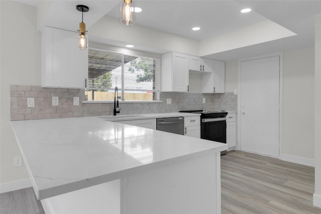 18010 Santolina Ln, Katy, TX 77449 - kitchen featuring black electric range, dishwasher, a sink, a peninsula, and white cabinets