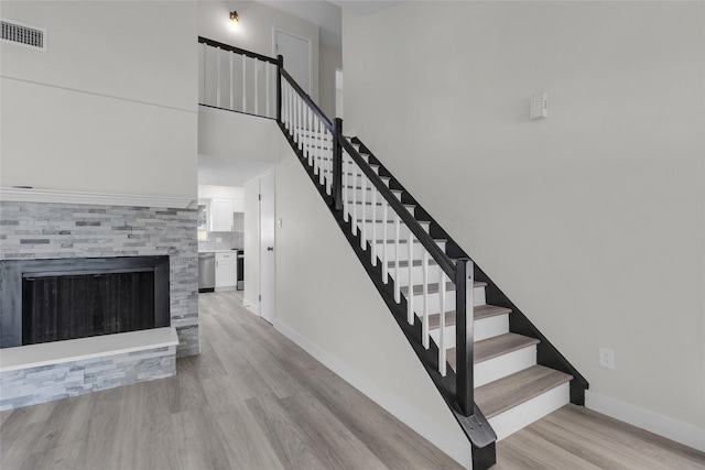 18010 Santolina Ln, Katy, TX 77449 - staircase featuring wood finished floors and baseboards