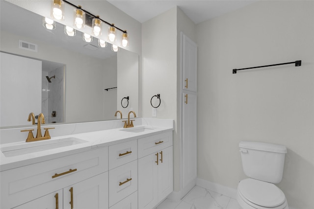 18010 Santolina Ln, Katy, TX 77449 - full bathroom featuring toilet, marble finish floors, tiled shower, baseboards, and double vanity