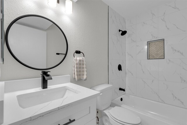 18010 Santolina Ln, Katy, TX 77449 - bathroom featuring vanity, toilet, shower / tub combination, and a textured wall